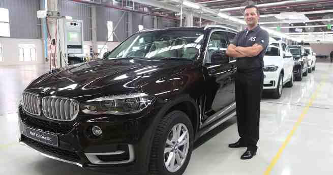 Mr. Robert Frittrang, Managing Director, BMW Plant Chennai with the all-new BMW X5 as it rolls out of BMW Plant Chennai