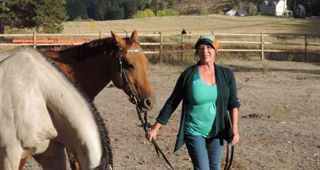 Dr. Joanna Ellington (Dr. E) takes an afternoon break with her horse LeDoux.