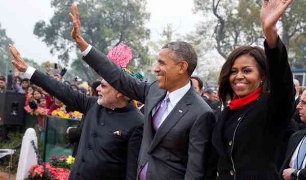 President Barack Obama and First Lady Michelle Obama wave to the crowd at the Rajpath saluting base following the Republic Day Parade in New Delhi, India. January 26, 2015. (Official White House Photo by Pete Souza)