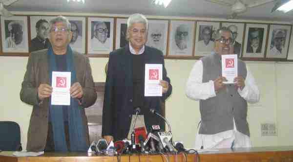 CPI-M leaders Sitaram Yechury, Prakash Karat, and K.Varadharajan releasing the draft political resolution for the 21st Congress.