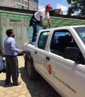 Save the Children staff unload emergency supplies for children and families left homeless by the earthquake in Nepal.