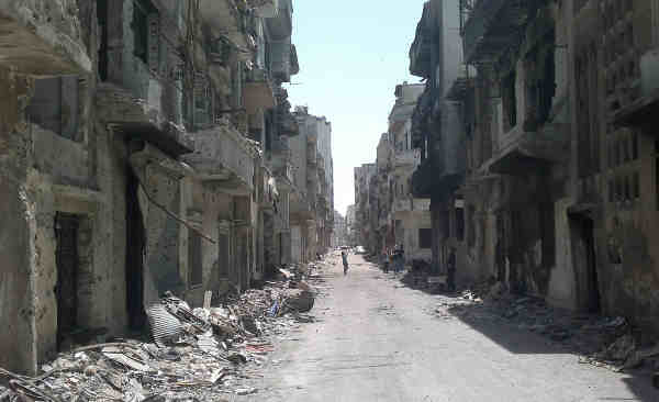 A street lined with rubble and destroyed buildings in the Old City area of Homs, Syria. Photo: UNICEF / Nasar Ali