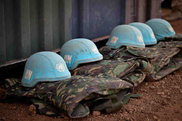 Blue helmets and uniforms of UN Peacekeepers. UN Photo / Marco Dormino