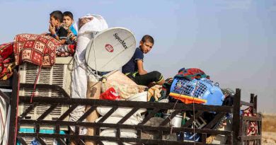 On 01 November children sit in the back of a truck loaded with their belongings on their way back home in Anbar Governorate, Iraq