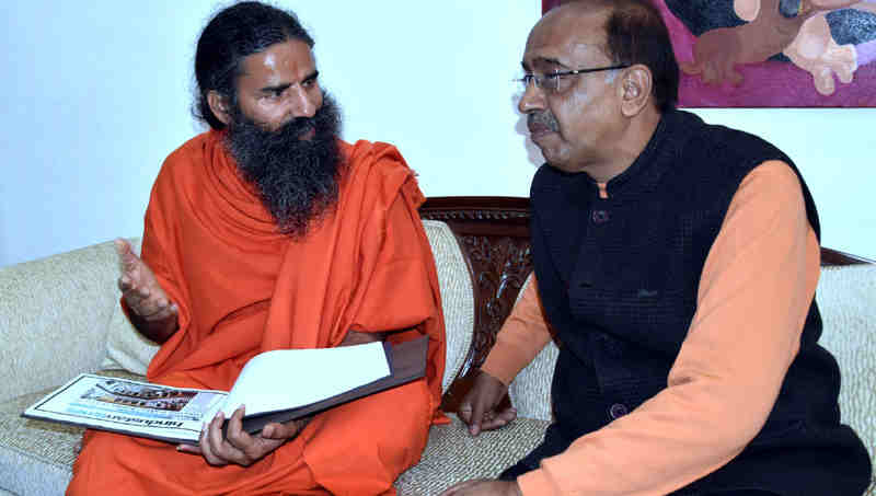 Yoga Guru Baba Ramdev meeting Minister Vijay Goel to promote yoga in sports - in New Delhi on December 06, 2016