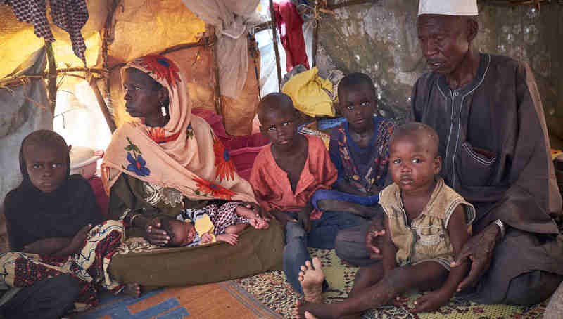 In Diffa, Niger, a family uprooted from Malam Fatouri, Nigeria, by Boko Haram shelter at a site for displaced civilians on 18 August 2016. Photo: UNICEF / Sam Phelps