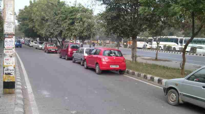 Cars parked on the roads of Delhi block the flow of traffic which can be hazardous. Photo by Rakesh Raman. Click the photo to read the story.