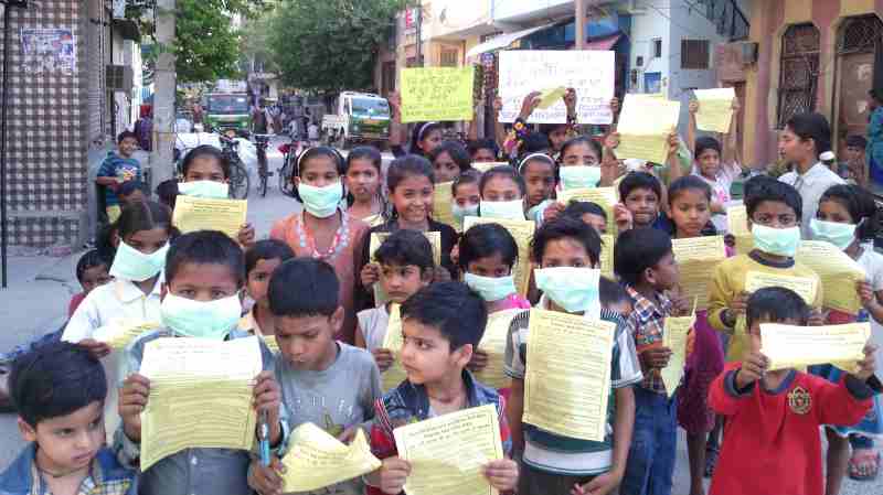 Children demonstrating in the streets of New Delhi so that the Indian government should protect them from dust pollution, noise pollution, and air pollution of extended FAR construction activity in occupied housing societies. Photo and Campaign by Rakesh Raman [ Click the photo to know the details. ]