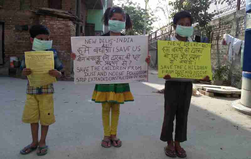 Children demonstrating in the streets of New Delhi so that the Indian government should protect them from dust and noise pollution coming from extended construction activity. Click the photo for details. Photo by Rakesh Raman