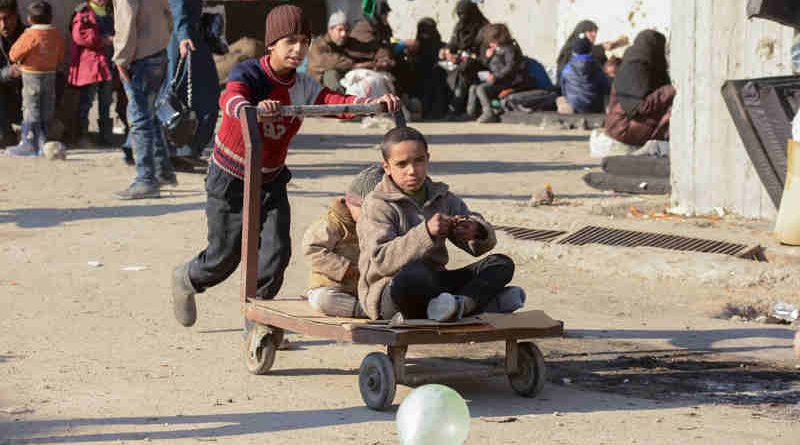 Children at a shelter in Jibreen, Aleppo, Syria, play with a cart. Photo: UNICEF/Rzehak
