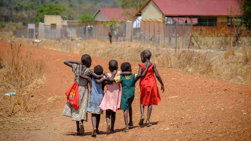 Refugee children walk home together after school in Nyumanzi refugee settlement. With thousands of new arrivals fleeing to Uganda every day, South Sudan is now AfricaÕs largest refugee crisis and the worldÕs third after Syria and Afghanistan Ð with less attention and chronic levels of underfunding. Photo: UNICEF
