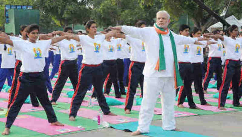 Narendra Modi Playing Yoga Tricks. Photo: Press Information Bureau