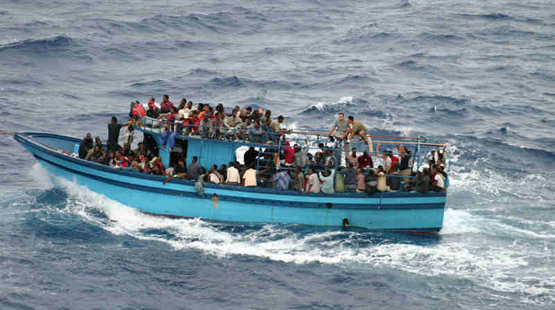 A boat carrying asylum seekers and migrants in the Mediterranean Sea. Photo: UNHCR/L.Boldrini