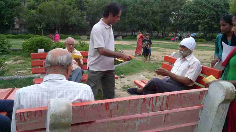 RMN Foundation founder and school teacher Rakesh Raman distributing pamphlets that explain the benefits of modern alternative education.