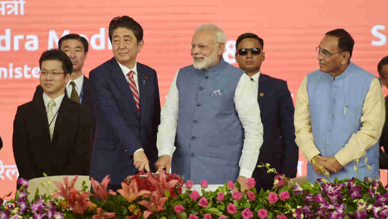 Narendra Modi and the Prime Minister of Japan, Mr. Shinzo Abe laying the foundation stone for Mumbai-Ahmedabad High speed Rail Project, at a function, at Ahmedabad, Gujarat on September 14, 2017. The Chief Minister of Gujarat, Shri Vijay Rupani is also seen.