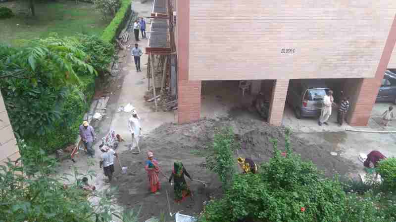 Deadly dust and noise pollution is caused by illegal construction in a cooperative group housing society of Dwarka, New Delhi. Government has failed to control the corrupt managing committees (MCs) of housing societies. Click the photo to know the details.