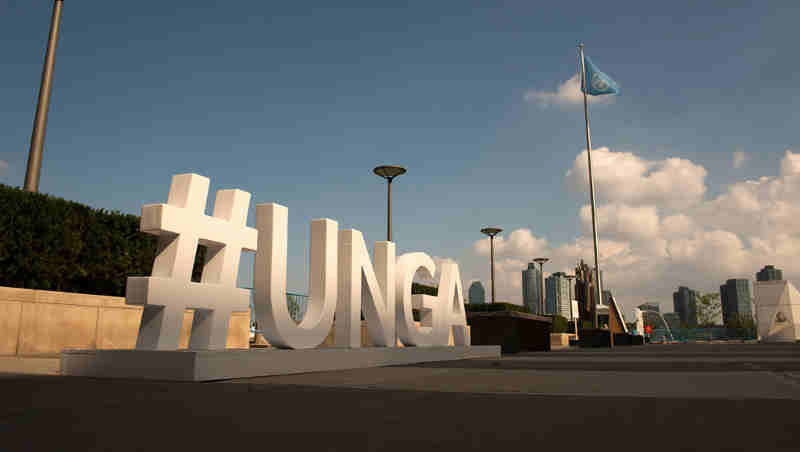 A sign outside the General Assembly building highlights the hashtag for attendees to use to promote the 72nd session's General Debate. UN Photo/Kim Haughton