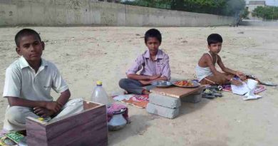 As school education is bad, young children are forced by parents to sell eatables outside a school building in New Delhi, India. Click the photo to know the details. Photo: Rakesh Raman / RMN News Service