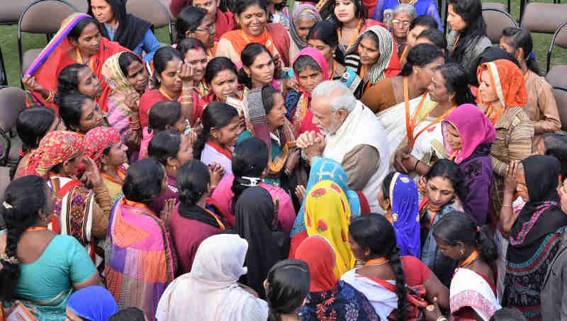 Narendra Modi interacting with the beneficiaries of the Pradhan Mantri Ujjwala Yojana, in New Delhi on February 13, 2018