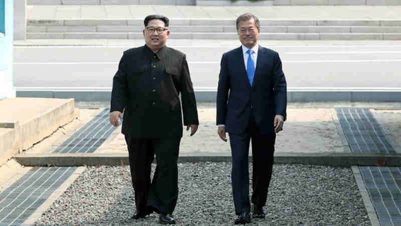 President Moon Jae-in (right) of the Republic of Korea greets Chairman of the State Affairs Commission Kim Jong-Un of the Democratic People's Republic of Korea in Panmunjeom. Photo: UN