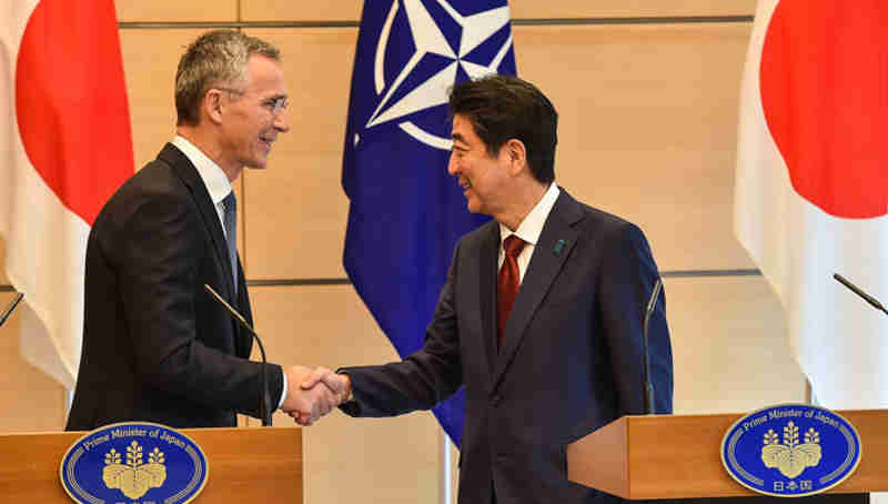NATO Secretary General Jens Stoltenberg shakes hands with Japanese Prime Minister Shinzo Abe at a joint press conference in Tokyo, 31 October 2017. Photo: NATO (file photo)