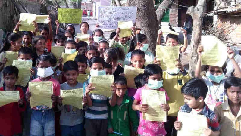 Children participating in RMN Foundation campaign to stop extended construction and pollution in Delhi.