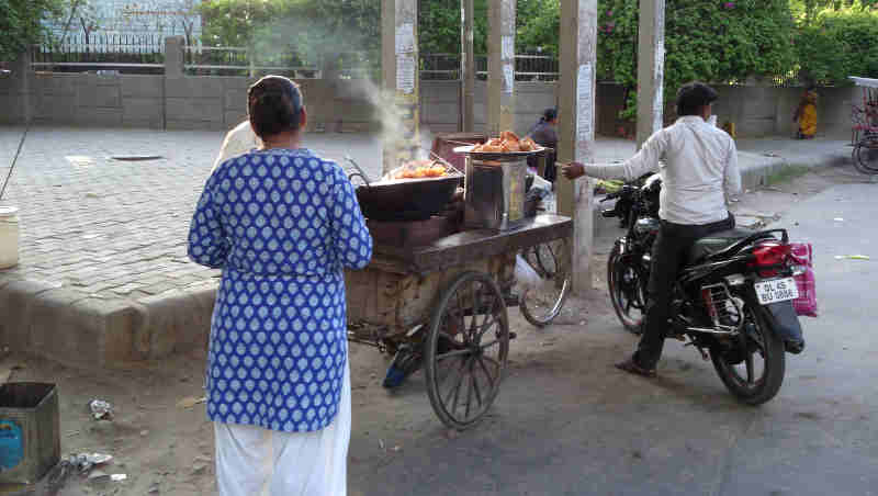 As unemployment is increasing exponentially in India, educated people are being asked to sell Pakoras (a low-cost eatable) on the streets. A Pakora seller in Delhi. Photo: Rakesh Raman / RMN News Service