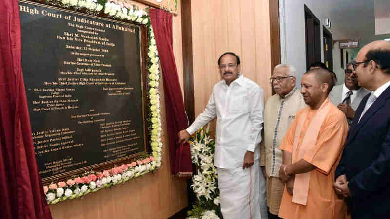The Vice President, Shri M. Venkaiah Naidu unveiling the plaque for the new building for Allahabad High Court, in Allahabad, Uttar Pradesh on October 13, 2018. The Governor of Uttar Pradesh, Shri Ram Naik, the Chief Minister of Uttar Pradesh, Shri Yogi Adityanath and other dignitaries are also seen.