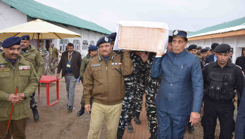 Rajnath Singh shouldering the coffin of a martyred CRPF Jawan, at the Regional Training Centre, in Srinagar on February 15, 2019. Photo: PIB (file photo)