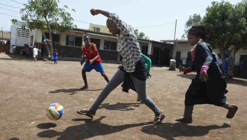 Children, including girls, play football at LEC centre of Boulaos in the city of Djibouti. Photo: UNICEF