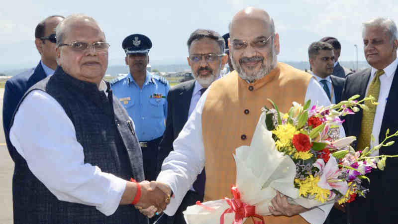 Amit Shah being received by the Governor of Jammu and Kashmir, Shri Satya Pal Malik on his arrival in Srinagar, Jammu and Kashmir on June 26, 2019. Photo: PIB