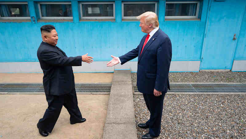 US President Donald Trump shakes hands with the Chairman of the Workers’ Party of Korea Kim Jong-un as the two leaders meet at the Korean Demilitarized Zone which separates North and South Korea on 30 June 2019. Photo: White House / Shealah Craighead