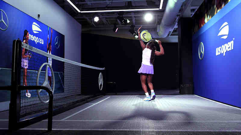 2017 US Open Champion and Mercedes-Benz Ambassador Sloane Stephens Tries the All-New Mercedes-Benz Augmented Reality Experience at the US Open Fan Zone featuring MBUX Technology.