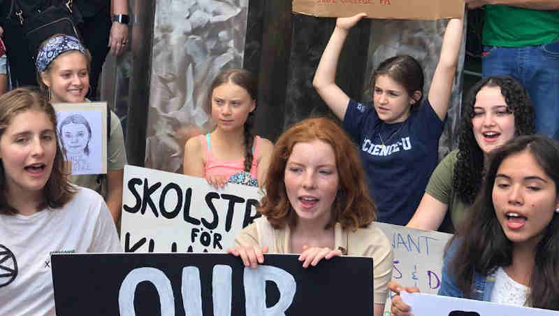 The Swedish teenage climate activist, Greta Thunberg joins other young people for a school strike or demonstration outside the United Nations in New York on 30 August 2019. UN Photo/Manuel Elias