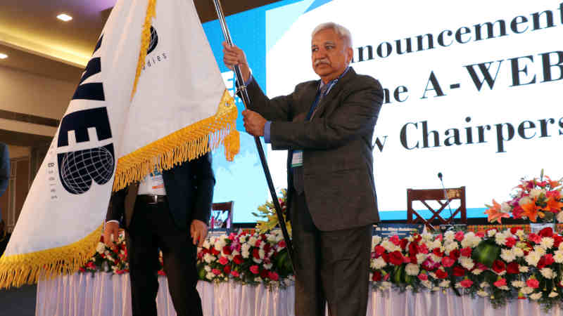 Sunil Arora with the A-WEB flag which was handed over by the outgoing Chairman of A-WEB from Romania, Ion Mincu Radulescu, at the inauguration of the 4th General Assembly meeting of A-WEB, in Bengaluru on September 3, 2019. Photo: PIB (file photo)