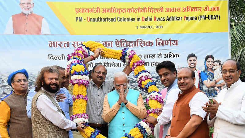 Narendra Modi being felicitated by the RWA Members for regularization of unauthorized colonies in Delhi, under the PM-UDAY (Unauthorised colonies in Delhi Awas Adhikar Yojna), in New Delhi on November 08, 2019. Photo: PIB