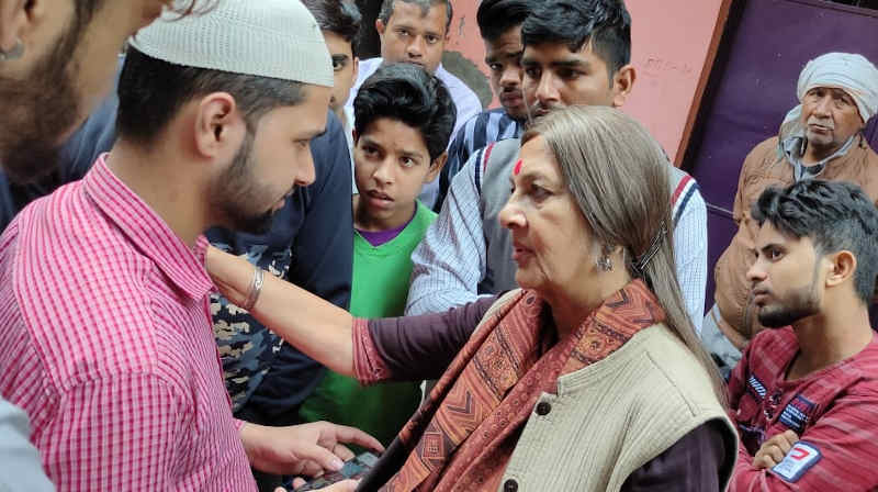 A CPI(M) leader Brinda Karat meeting people affected by Delhi violence. Photo: CPI(M)