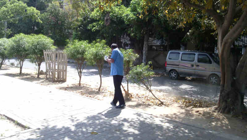 A worker cleans a road during coronavirus lockdown in New Delhi which is among the worst-affected cities of India. Photo: Rakesh Raman / RMN News Service