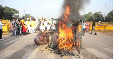 Protesters burn a tractor in New Delhi on September 28, 2020 to oppose the farm laws introduced by the Modi government. Photo: Indian Youth Congress