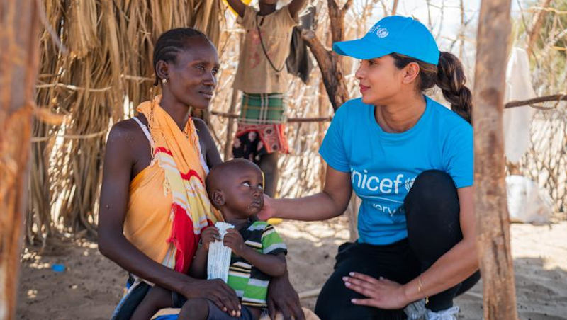 UNICEF Goodwill Ambassador Priyanka Chopra Jonas meets 2-year-old Apolo Lokai who is being treated for malnutrition with a sachet of ready-to-use therapeutic food (RUTF). Photo: UNICEF