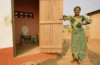 Rakiya Abdullah next to her latrine, Sagnarigu, Tamale, Northern Region, Ghana. WaterAid