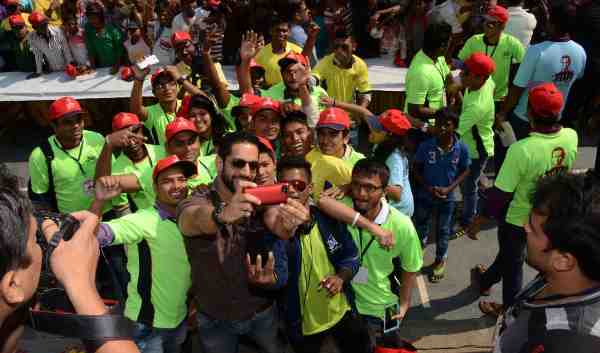 Actor Salil Acharya taking a selfie with kids at the Don Bosco Mela sponsored by WWE