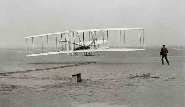 The Wright Flyer: the first sustained flight with a powered, controlled aircraft.