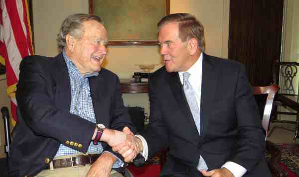 President George H.W. Bush, Honorary Chairman of the National Organization on Disability, shaking hands with Tom Ridge, Chairman of the National Organization on Disability