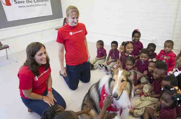 Save the Children Animal Ambassador Lassie delights children at a Save the Children "Prep Rally" at the Kingsley House Head Start Program in New Orleans. Photo by Lee Celano/Getty.