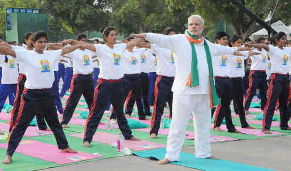Narendra Modi Playing Yoga Tricks. Photo: Press Information Bureau