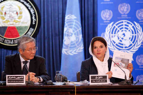 At a press conference in Kabul, (left) Tadamichi Yamamoto, the Secretary-General’s Special Representative for Afghanistan and head of UNAMA, and (right) Danielle Bell, Director, Human Rights Unit, UNAMA, present latest report on civilian casualties. Photo: UNAMA / Fardin Waezi.