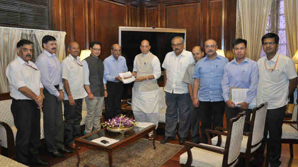 Madhukar Gupta presents report to the Union Home Minister, Rajnath Singh, in New Delhi on August 29, 2016