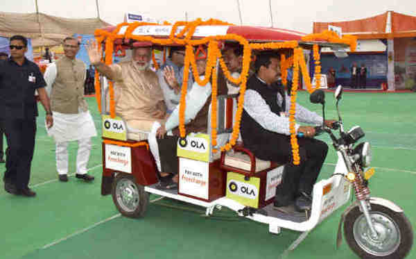 PM Narendra Modi taking a ride on e-Rickshaw, on the launch of ‘Stand up India’ programme, in Noida, Uttar Pradesh on April 05, 2016