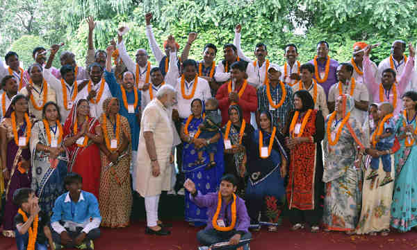 Narendra Modi interacting with the Village Pradhans from Varanasi Parliamentary Constituency, in New Delhi on August 08, 2016